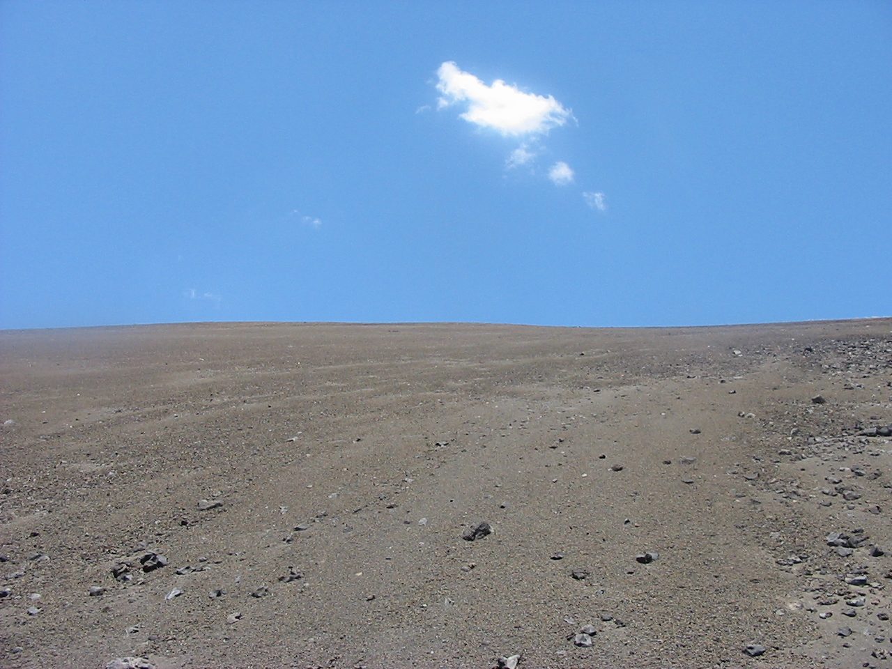 Nothing but ash.  Looking up towards the top of Cinder Cone.  A lone cloud overhead.