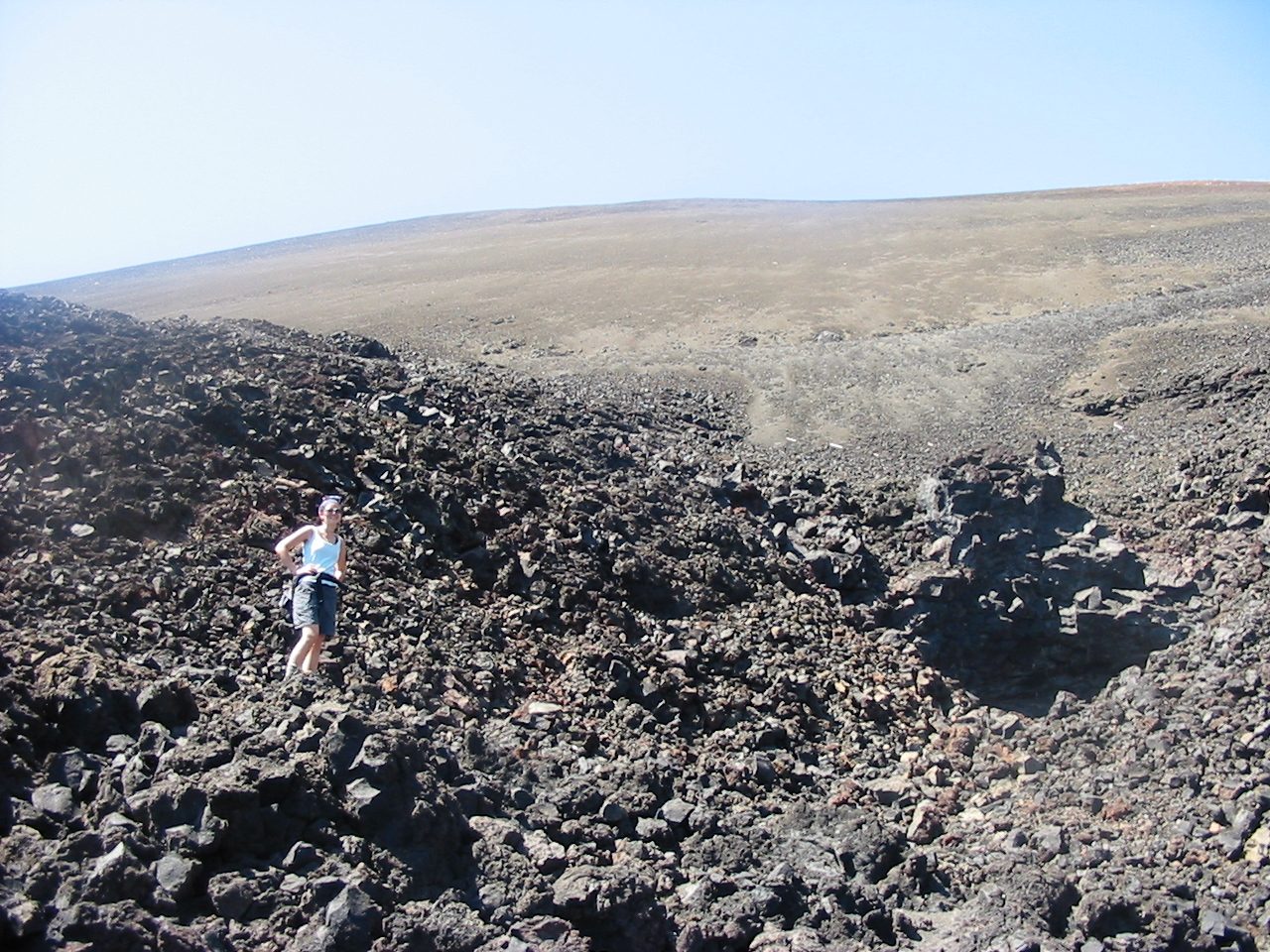 Rachel boulder-hopping in the fantastic lava beds.