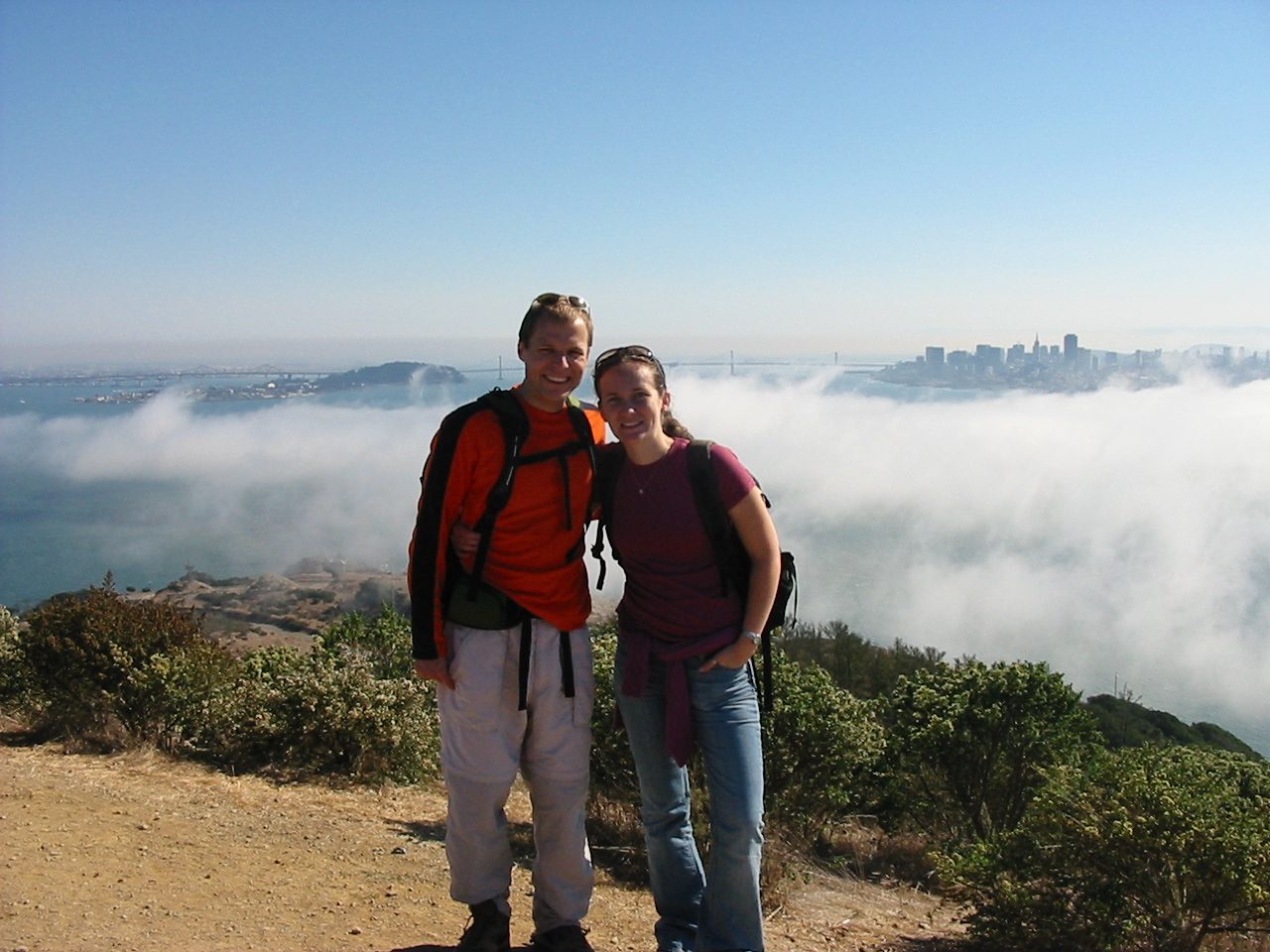 John and Rachel at the highest point on Angel Island.  Foggy San Francisco in the background.