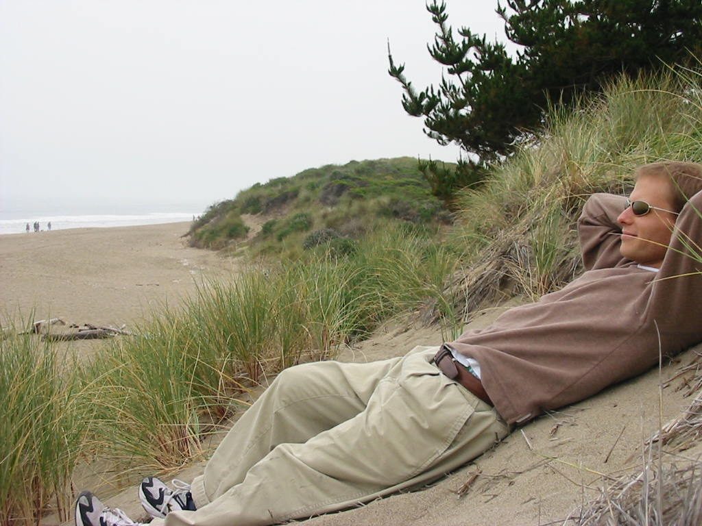 John relaxing on the beach.  Cloudy as usual.