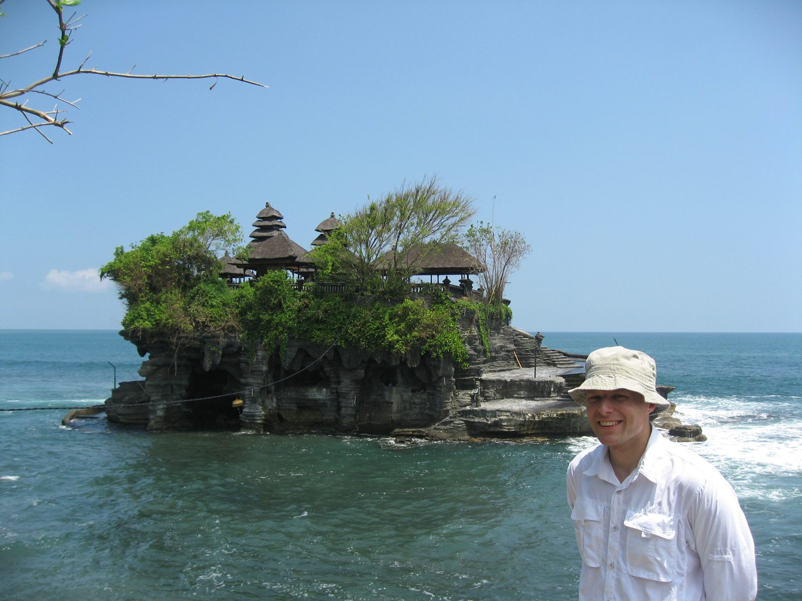 John in front of a Hindu temple on the southwest coast of Bali.