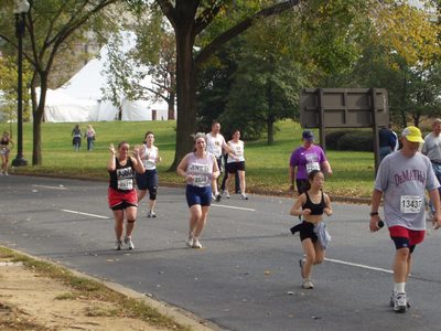 Anna and Jennifer run by, going strong.