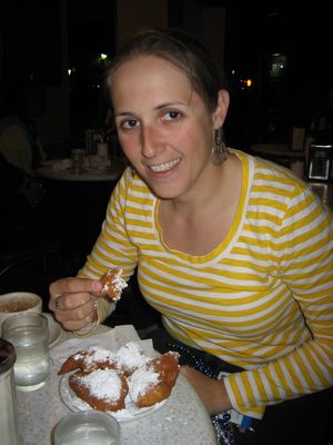 Eating beignets and drinking cafe au lait at Cafe Du...