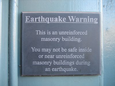 Awesome warning sign near the door to a fancy home...