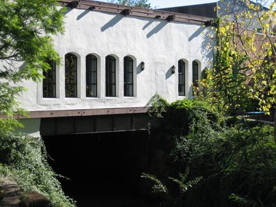 Bridge over the creek in SLO, with buildings on the side...