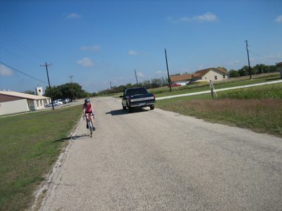 Kate riding down a small country road, as taken by...