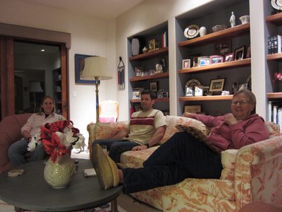 Time-delay shot of the three watching Despicable Me.