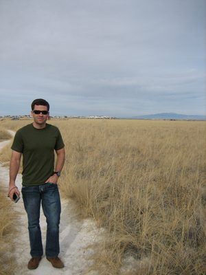 Jay walks up the path in the park.