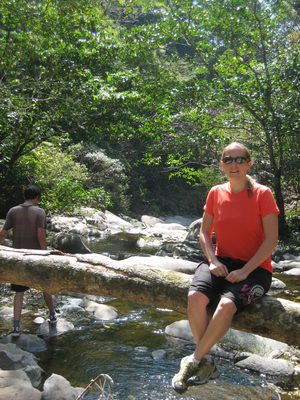 Chilling on a log over the river.