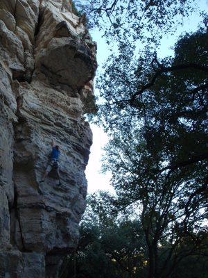 Reaching for the next hold.