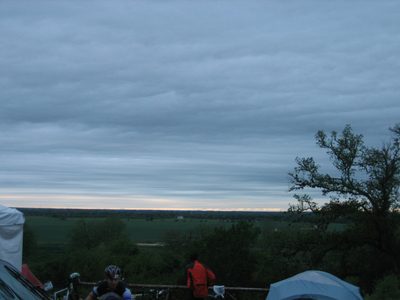 Sunrise over the field near our tent (the corner of...