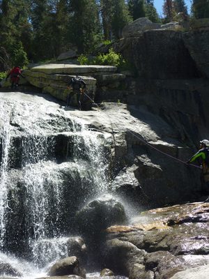 Tommer on rappel, with Jon providing a fireman's belay. ...
