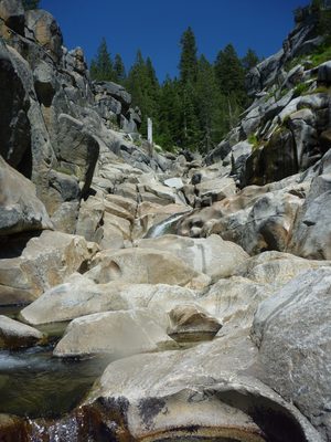 Looking up canyon at the boulders and waterfalls we've...