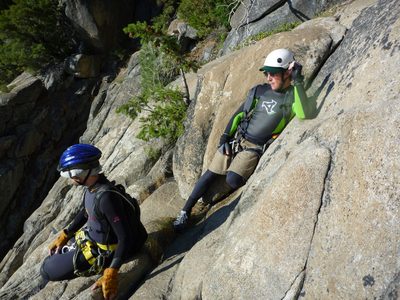 Tommer and Jon watch Monica rappel.