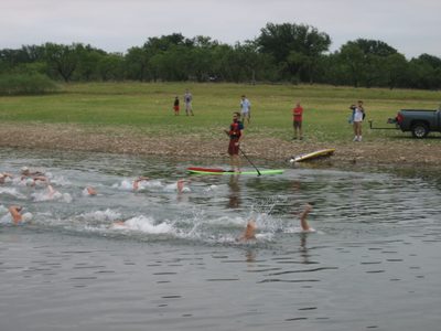 Swimmers splash by.