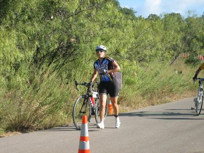 Running my bike towards transition.