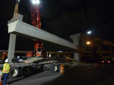 Lift beam.  Push beam east, so west crane can swing beam...