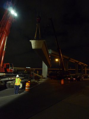 Now swing beam west so east crane can rotate beam past itself.