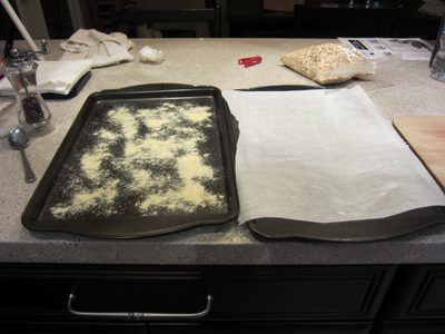 One tray prepared with cornmeal, one without.