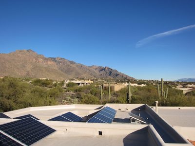 Looking at solar panels and the mountains.