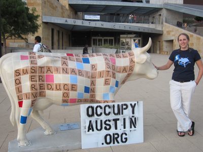 Catherine in downtown Austin, by a painted Scrabble-tile...