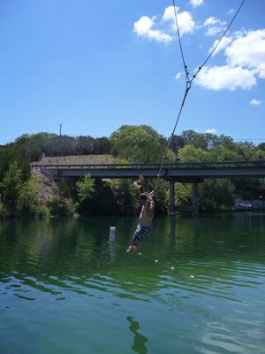 Andrew coming off the rope swing.