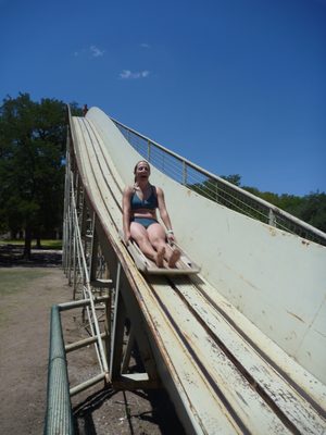Going down a crazy slide into the water at Mo-Ranch.