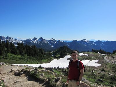 Jay with the trail and Mt. Adams behind to the left, St....