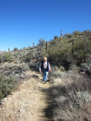 Dad hikes up the trail with John hot on his heels.
