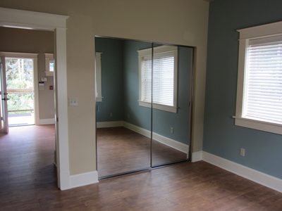 Closet of the front bedroom, and the front door.