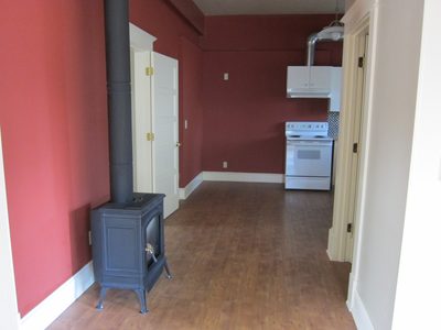 From in front of the front bedroom door, looking towards...