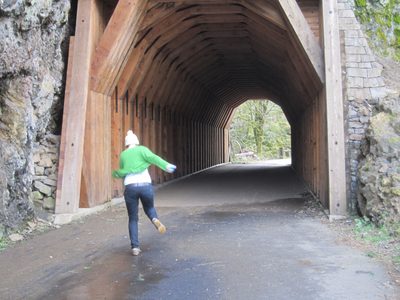 Emily runs excitedly to the tunnel.