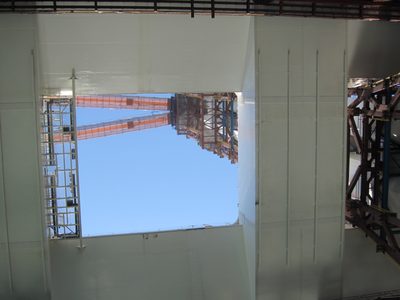 Looking up through the space between the two bridge...
