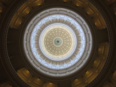 Looking up at the dome of the Texas State Capitol building.