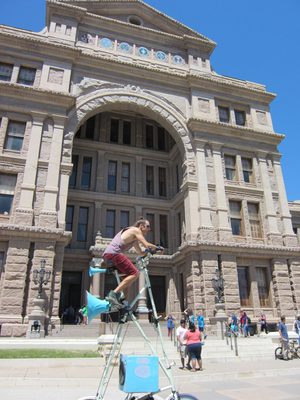 This guy was riding a giant bicycle around in front of...