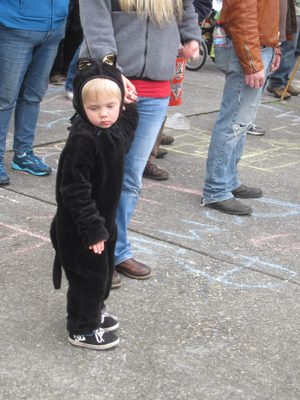 Example of an adorable but unhappy child, being toted...