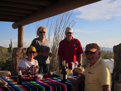 Gretchen, Mom, Jim, and Dad as dinner comes together.
