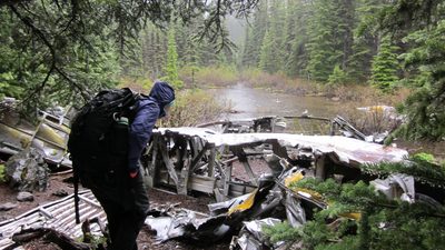 Exploring the plane parts.  Note the raindrops on the...