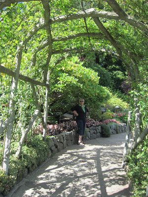Mom poses at the end of an arbor (is that the right...