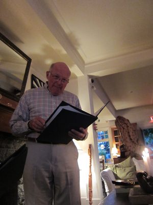 Dad contemplates the menu (or the wine list?).