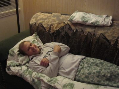 John settles in to his couch-bed at the Alpen Chalet...