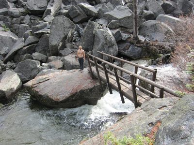 John poses on the far side of the creek.