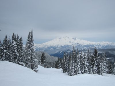 Mt Rainier becomes visible through the morning clouds.