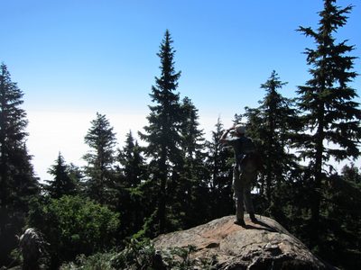 Frank looks down towards Hood Canal and Lake Cushman. ...