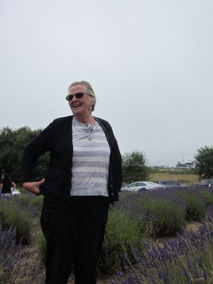 Mom stands among the lavender bushes.