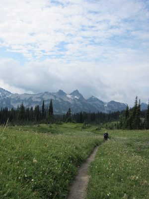 Lucie hiking down the Lakes Trail. There is some blue in...