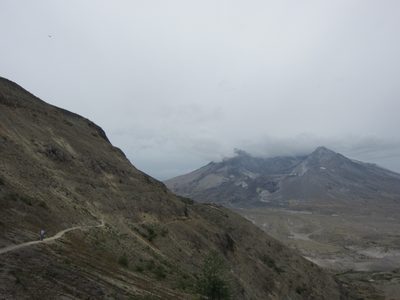 Dad points to the mountain, which is slowly being lost...