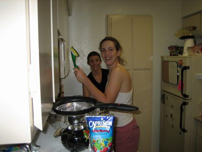 Laura and Katie in the kitchen, cleaning up