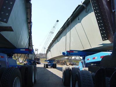 Girders on trucks.