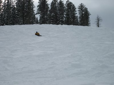 Jay taking a break in some mad pow near the Lone Moose...